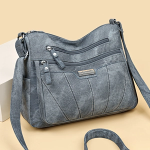 Gray blue minimalist crossbody bag with multi-zipper pockets and adjustable strap