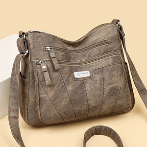 Brown vintage shoulder bag with multiple zipper pockets and embroidered stitching detail