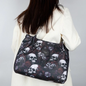 Gothic tote bag with white skull and purple floral print featuring metal chain straps