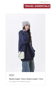 Detail shot of a minimalist cream-colored drawstring crossbody phone bag with ruched texture