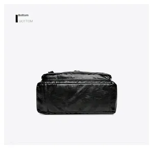 Detail view showing the reinforced bottom structure and premium leather texture of the bag
