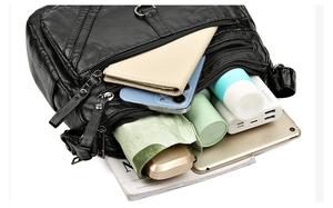 Interior view showing the large capacity and multiple zipper pockets for tablets and umbrellas