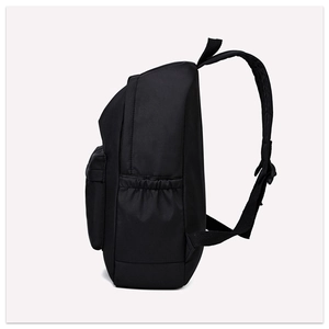 Side view of black oxford cloth backpack showing side pocket and thick shoulder strap