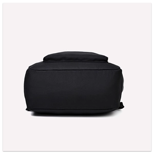 Detailed bottom view of black Oxford cloth backpack showing durable seams and wide base