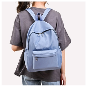 Minimalist light blue oxford backpack with waterproof material for daily travel or school