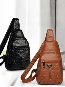 Detail view of vintage PU leather chest bags with heart accents in black and brown colors