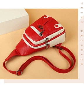 Macro shot of red and white lychee texture leather chest bag with heart metal ornament