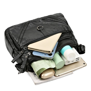 Sac bandoulière multi-couches en cuir noir avec plusieurs zips et grande capacité