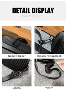 Detail view of smooth zipper, strap hook and adjustable strap for black hardshell cross-body bag