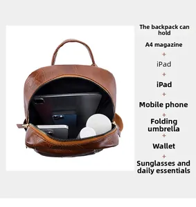 Detail view of large capacity vintage brown PU leather backpack storage for iPad and daily items