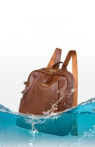 Detail of vintage brown PU leather backpack highlighting water-resistant surface texture