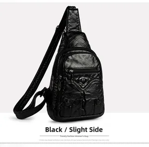 Detail of black PU leather chest bag with heart charm and multi-pocket design