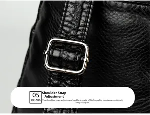 Detail of adjustable strap on black faux crocodile leather bag with silver buckle