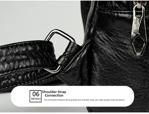 Detailed macro view of silver metal buckle and stitch on black textured leather bag