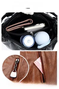 Detail view of large capacity PU leather bucket bag with multiple inner storage compartments