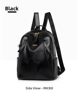 Detail view of black PU leather backpack with leaf vein stitching and gold zippers