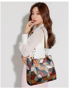 Detail of colorful geometric pattern tote bag with embossed leather and logo patch