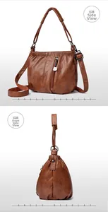 Detail view of brown soft PU leather bucket bag with drawstring and zip pockets
