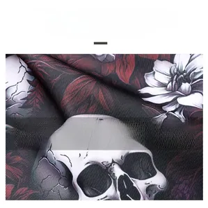 Macro detail of skull and floral print fabric on a durable large crossbody bag