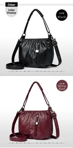 Close-up of soft PU leather crossbody bags in black and burgundy with vertical zippers