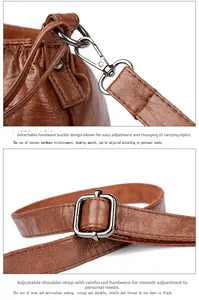 Detail of brown litchi pattern leather bag with adjustable strap and metal hardware hooks