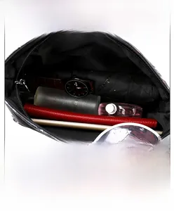 Detail view of large skull print bag with multi-layer inner pockets and front zipper