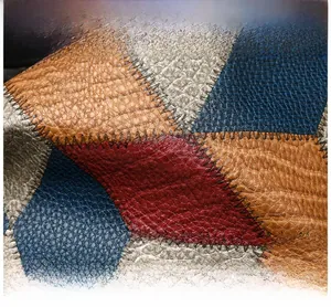 Macro detail of multi-color leather tote with premium texture and handcrafted stitching