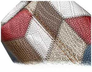 Macro shot of colorful leather patchwork with detailed stitching on a large tote bag