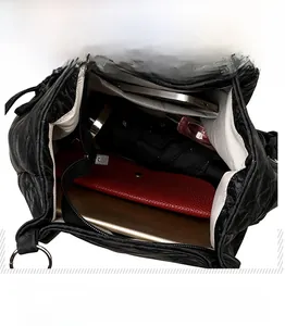 Detail view of spacious black tote interior showing tablet and daily essentials storage