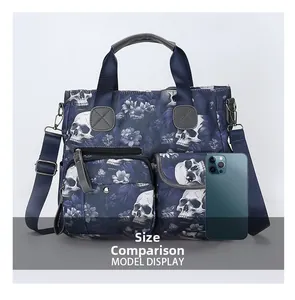 Size comparison of a blue skull floral tote bag next to a smartphone showing high capacity
