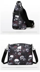 Detail view of large shoulder bag with colorful skull and floral graffiti print pattern