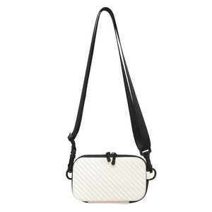 White hardshell crossbody bag with textured diagonal stripes and black adjustable strap