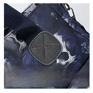 Macro view of reinforced cross stitching and metal hook on skull print tote bag