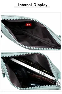 Detail der hellgrünen Nylon-Schultertasche mit Innenfach und glattem Reißverschluss