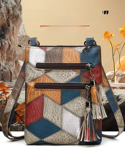 Close-up of retro PU leather crossbody bag featuring geometric patchwork and tassel detail