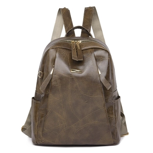 Vintage olive green PU leather backpack for women with geometric stitching and gold accents