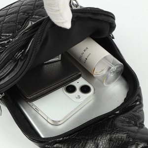 Quilted black PU leather crossbody bag with spacious interior for mobile phone and wallet
