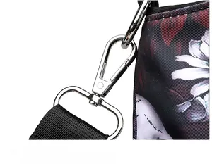 Detail of silver metal buckle and durable black nylon strap with floral print