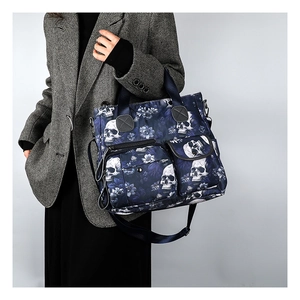 Detailed view of skull and floral print on large capacity oxford fabric tote bag