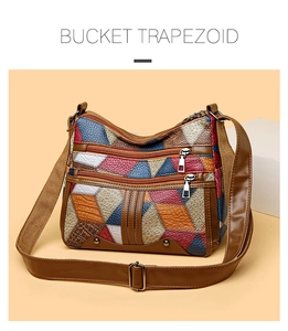 Detail of vintage patchwork leather trapezoid bag with multi-color geometric panels