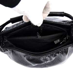Black pebbled PU leather bucket bag with multiple interior zipper compartments