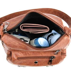 Retro brown multi-pocket crossbody bag with large capacity showing spacious interior compartments