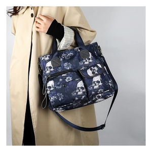 Detailed view of the skull print tote bag with multiple pockets and durable fabric