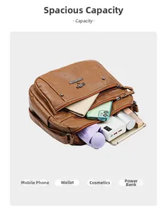 Internal view of brown leather bag showing multiple compartments and large capacity