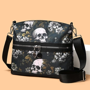 Gothic crossbody bag with white skull and floral print on black canvas fabric