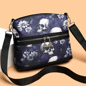 Gothic purple shoulder bag with white skull and floral prints and adjustable strap