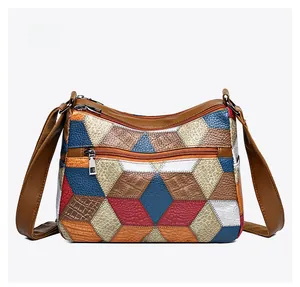 Macro detail of multicolored patchwork leather bag back with zippered pocket
