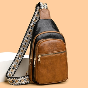 Retro multi-compartment crossbody bag in bicolor lychee grain leather with patterned strap