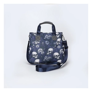 Detail of silver metal buckles and detachable shoulder strap on skull print tote bag
