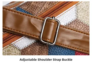 Detail of adjustable shoulder strap buckle on a multi-color patchwork leather crossbody bag